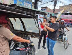 Polres Samosir Tebar Semangat Nasionalisme Lewat Pembagian Bendera Merah Putih