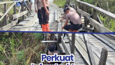 Personel Batalyon C Satuan Brimob Polda Sumatera Utara melaksanakan kegiatan perbaikan Jembatan Gotting di Desa Purbasinomba, Kecamatan Siborongborong, Kabupaten Tapanuli Utara, Senin (4/5/2026).